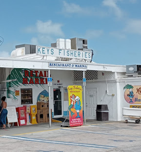 Famous lobster reuben sandwich and fresh catch at Keys Fisheries Marathon FL outdoor dining
